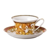 The most legendary figure of Asian mythology, the red dragon rises majestically from this fabulously opulent dinnerware from Rosenthal Meets Versace, conveying all its might and glory. Each piece features ornate golden baroque patterns and four small medallions representing the sun, and the Versace medusa decorates the background.