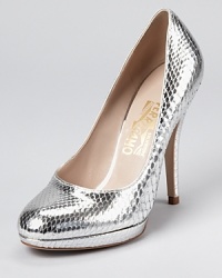 Shimmering in snakeskin, these metallic pumps from Salvatore Ferragamo add gleaming glamour to day or night. Shimmering in snakeskin, these metallic pumps from Salvatore Ferragamo add gleaming glamour to day or night.
