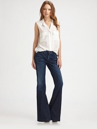 Ultra wide back-kick flares, lightly distressed and shaped for body-hugging curves.THE FITFitted through hips and thighsRise, about 8Inseam, about 34THE DETAILSZip flyFive-pocket styleBack patch pockets89% cotton/11% polyesterMachine washMade in USA of Italian fabricModel shown is 5'10 (177cm) wearing US size 4. Ultra wide back-kick flares, lightly distressed and shaped for body-hugging curves.THE FITFitted through hips and thighsRise, about 8Inseam, about 34THE DETAILSZip flyFive-pocket styleBack patch pockets89% cotton/11% polyesterMachine washMade in USA of Italian fabricModel shown is 5'10 (177cm) wearing US size 4.