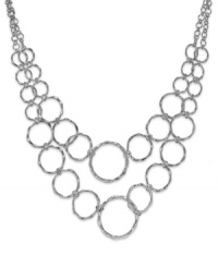 Add a captivating look to your attire with this circle link necklace from Sequin. Crafted in silver tone mixed metal. Approximate length: 15 inches + 3-inch extender. Approximate drop: 3 inches. Add a captivating look to your attire with this circle link necklace from Sequin. Crafted in silver tone mixed metal. Approximate length: 15 inches + 3-inch extender. Approximate drop: 3 inches.