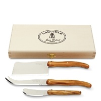 Crafted in France, this chic and practical Laguiole cheese set features olive wood handles and safely stores in a closing wood box.