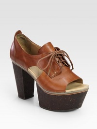 Ultra-high heel, platform and peep toe rejuvenate this lace-up leather classic. Cork heel, 4 (100mm)Cork platform, 2 (50mm)Compares to a 2 heel (50mm)Leather upperLeather liningRubber soleImportedOUR FIT MODEL RECOMMENDS ordering true whole size; ½ sizes should order the next whole size up. Ultra-high heel, platform and peep toe rejuvenate this lace-up leather classic. Cork heel, 4 (100mm)Cork platform, 2 (50mm)Compares to a 2 heel (50mm)Leather upperLeather liningRubber soleImportedOUR FIT MODEL RECOMMENDS ordering true whole size; ½ sizes should order the next whole size up.