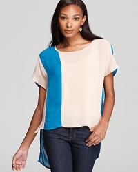 Sam & Lavi's color block tee has a dramatic impact on everyday denim with asymmetrical panels of blue and beige. Sam & Lavi's color block tee has a dramatic impact on everyday denim with asymmetrical panels of blue and beige.