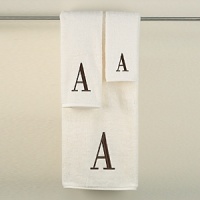 Monogram letter towels: A classic and sophisticated look, this monogrammed collection features a soft, plush oversized 100% combed cotton loop terry towel made of the finest quality materials. Choose from a white towel with a silver metallic embroidered letter of your choice in Bodoni font or an ivory towel with a brown embroidered letter of your choice in Bodoni font. All letters available A - Z.