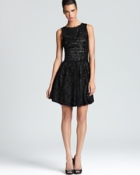 With hundreds of soft ruffles, Nicole Miller's sweet sleeveless dress shows off a v back for an alluring, feminine finish. With hundreds of soft ruffles, Nicole Miller's sweet sleeveless dress shows off a v back for an alluring, feminine finish.
