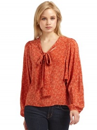 THE LOOKPrinted designPullover styleV-neck with tie detailLong button cuff dolman sleevesTHE FITAbout 25 from shoulder to hemTHE MATERIALSilkCARE & ORIGINDry cleanImportedModel shown is 5'10 (177cm) wearing US size Small. THE LOOKPrinted designPullover styleV-neck with tie detailLong button cuff dolman sleevesTHE FITAbout 25 from shoulder to hemTHE MATERIALSilkCARE & ORIGINDry cleanImportedModel shown is 5'10 (177cm) wearing US size Small.