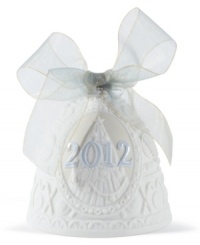 Jingle all the way. Featuring sculpted white porcelain tied up in an ice-blue bow, this handcrafted bell ornament by Lladro makes your Christmas tree sing year after year. Jingle all the way. Featuring sculpted white porcelain tied up in an ice-blue bow, this handcrafted bell ornament by Lladro makes your Christmas tree sing year after year.