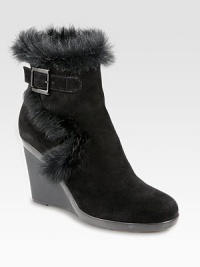 Practical yet fashion-forward, a heightened suede ankle boot trimmed with lush rabbit fur. Rubber wedge, 3¾ (95mm)Rubber platform, ½ (15mm)Compares to a 3¼ heel (80mm)Weatherproof suede upper with rabbit fur trimAdjustable buckle strap and inside zipBreathable microfiber liningSlip resistant rubber solePadded insoleMade in Italy Practical yet fashion-forward, a heightened suede ankle boot trimmed with lush rabbit fur. Rubber wedge, 3¾ (95mm)Rubber platform, ½ (15mm)Compares to a 3¼ heel (80mm)Weatherproof suede upper with rabbit fur trimAdjustable buckle strap and inside zipBreathable microfiber liningSlip resistant rubber solePadded insoleMade in Italy