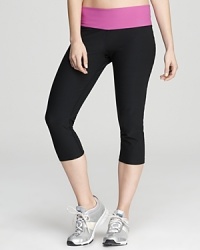 A contrast waistband adds a jolt of color to these stylish Nike capri pants, made with Dri-FIT technology to wick away moisture. A contrast waistband adds a jolt of color to these stylish Nike capri pants, made with Dri-FIT technology to wick away moisture.