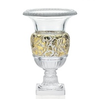 This large, classic urn vase, originally designed by René Lalique in 1939, has been updated with 24 karat gold accents. This large, classic urn vase, originally designed by René Lalique in 1939, has been updated with 24 karat gold accents.