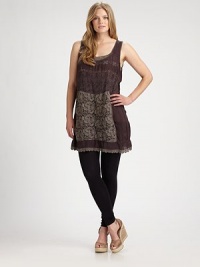 Style is all about versatility. This gorgeous tunic with a lace panel, offers just that when you pair it with sleek pants or opaque tights. U-neckSleevelessEmbroidered trimPull-on styleScalloped hemAbout 36 from shoulder to hemRayonMachine washImported Style is all about versatility. This gorgeous tunic with a lace panel, offers just that when you pair it with sleek pants or opaque tights. U-neckSleevelessEmbroidered trimPull-on styleScalloped hemAbout 36 from shoulder to hemRayonMachine washImported