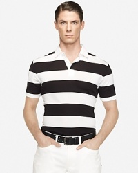 Cut in a trim, contemporary silhouette, a striped short-sleeved rugby shirt embodies modern athleticism in fine-ribbed cotton that's mercerized for a handsome luster. Cut in a trim, contemporary silhouette, a striped short-sleeved rugby shirt embodies modern athleticism in fine-ribbed cotton that's mercerized for a handsome luster.