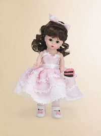 This pretty brunette miss brings birthday wishes to a lucky young lady on her special day.8 cloth dollDressed in a pink, full-skirted frock with floral embroidery and white Mary Jane slippersShe offers a luscious-looking slice of birthday cakeRecommended for ages 3 and upImported