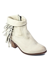 Frisky fringe lends Western flair to Sam Edelman's Louie booties, in vintage-look, distressed leather. Frisky fringe lends Western flair to Sam Edelman's Louie booties, in vintage-look, distressed leather.
