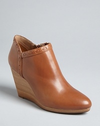 Low profile, high style: These Jack Rogers booties feature Western-influenced whipstiching accenting streamlined, notched cuffs, finished off with polished wedge heels. It's a basic with a distinct perspective. Low profile, high style: These Jack Rogers booties feature Western-influenced whipstiching accenting streamlined, notched cuffs, finished off with polished wedge heels. It's a basic with a distinct perspective.