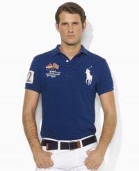 A trim-fitting polo shirt in breathable cotton mesh is finished with bold country details and Ralph Lauren's signature Big Pony. A trim-fitting polo shirt in breathable cotton mesh is finished with bold country details and Ralph Lauren's signature Big Pony.