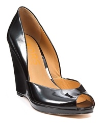 Patent leather peeptoe wedges from KORS Micheal Kors, oh so high yet oh so comfortable. A versatile shoe that goes from day to night with ease. Patent leather peeptoe wedges from KORS Micheal Kors, oh so high yet oh so comfortable. A versatile shoe that goes from day to night with ease.
