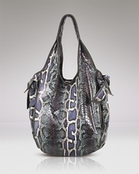 This snake motif enters covet-worthy terrain with this slouchy leather tote from Kooba. It features a shoulder-right shape accented with practical pockets for the essentials. This snake motif enters covet-worthy terrain with this slouchy leather tote from Kooba. It features a shoulder-right shape accented with practical pockets for the essentials.