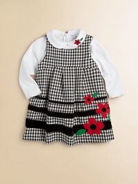 A must-have for your little girl, this cute check jumper features bold flowers and contrasting stripes.ScoopneckSleevelessBack zipperPolyesterMachine washImported