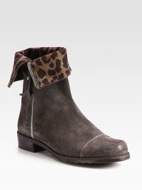 The rugged character of this buffed, velour leather style is given the chic finish of a leopard-print lining. Can be worn straight up or cuffed.Stacked heelVelour leather upperSide zipperLeather liningPadded insoleExclusive rubber soleMade in Spain The rugged character of this buffed, velour leather style is given the chic finish of a leopard-print lining. Can be worn straight up or cuffed.Stacked heelVelour leather upperSide zipperLeather liningPadded insoleExclusive rubber soleMade in Spain