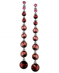 Purple pops in this pair of earrings from GUESS. Crafted from hematite-tone mixed metal, the earrings dazzle with purple glass crystal stones for a stylish take. Item comes packaged in a signature GUESS Gift Box. Approximate drop: 4 inches. Purple pops in this pair of earrings from GUESS. Crafted from hematite-tone mixed metal, the earrings dazzle with purple glass crystal stones for a stylish take. Item comes packaged in a signature GUESS Gift Box. Approximate drop: 4 inches.