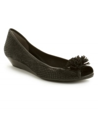 Snake embossing adds an exotic flair to DKNYC's Brandi wedges. The low wedge heel provides support and comfort and the embellishment at the toe brings a ladylike appeal. Snake embossing adds an exotic flair to DKNYC's Brandi wedges. The low wedge heel provides support and comfort and the embellishment at the toe brings a ladylike appeal.