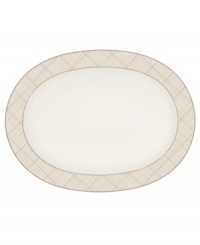 Dressed in a fine diamond grid of bronze and warm taupe, this oval platter is tailored for formal dining and everyday elegance in Noritake bone china. A handsome host for holiday meals or anytime feasts. From Noritake's collection of serveware and serving dishes. Dressed in a fine diamond grid of bronze and warm taupe, this oval platter is tailored for formal dining and everyday elegance in Noritake bone china. A handsome host for holiday meals or anytime feasts. From Noritake's collection of serveware and serving dishes.