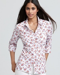C&C California puts a feminine twist on the perennial button-up with a petite floral print and slim silhouette. C&C California puts a feminine twist on the perennial button-up with a petite floral print and slim silhouette.