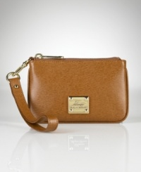 Exuding chic modern polish in supple textured leather, the Newbury wristlet is a versatile complement to any ensemble in a slender silhouette with optional wrist strap. Exuding chic modern polish in supple textured leather, the Newbury wristlet is a versatile complement to any ensemble in a slender silhouette with optional wrist strap.