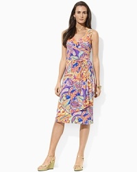 Smooth paisley jersey flatters the body in a feminine A-line silhouette with an elegant cross-wrap neckline. Smooth paisley jersey flatters the body in a feminine A-line silhouette with an elegant cross-wrap neckline.