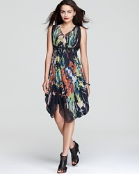 Ultra-chic for beach getaways and cocktail hour alike, this Nicole Miller dress boasts a painterly floral print for artistic flair. Ultra-chic for beach getaways and cocktail hour alike, this Nicole Miller dress boasts a painterly floral print for artistic flair.