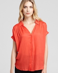 A versatile go-with-all, this sheer Aqua button-down top pairs with sleek denim for cool-girl weekend style. A versatile go-with-all, this sheer Aqua button-down top pairs with sleek denim for cool-girl weekend style.