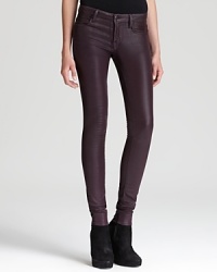 These Helmut Lang skinny jeans boast a coated glossy wash for subtle sheen, streamlining themselves with these season's glamour trend. These Helmut Lang skinny jeans boast a coated glossy wash for subtle sheen, streamlining themselves with these season's glamour trend.