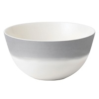 A watercolor wash of gradient gray migrates toward a warm neutral center to create an organic ombre effect on this durable, adaptable bowl from Vera Wang. A watercolor wash of gradient gray migrates toward a warm neutral center to create an organic ombre effect on this durable, adaptable bowl from Vera Wang.