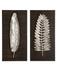 Standout wall art. Two polished aluminum leaves spring from ebony-stained panels, adding brilliant dimension and natural allure beside a table or above the bed. Standout wall art. Two polished aluminum leaves spring from ebony-stained panels, adding brilliant dimension and natural allure beside a table or above the bed.