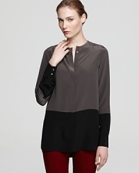 A whisper-light blouse enlivened by the color block trend for modern sophistication in pure silk. A whisper-light blouse enlivened by the color block trend for modern sophistication in pure silk.