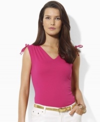 A classic sleeveless tee is updated with chic ruched detailing at the arms in this Lauren by Ralph Lauren look. A classic sleeveless tee is updated with chic ruched detailing at the arms in this Lauren by Ralph Lauren look.