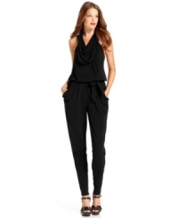 MICHAEL Michael Kors' halter-neck jumpsuit makes a sleek evening ensemble with its slim-fitting silhouette. MICHAEL Michael Kors' halter-neck jumpsuit makes a sleek evening ensemble with its slim-fitting silhouette.