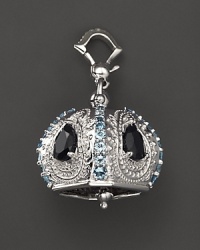 Inspired by Zen philosophy, this polished sterling silver Raja meditation bell from Paul Morelli is set with blue topaz and black spinel. Inspired by Zen philosophy, this polished sterling silver Raja meditation bell from Paul Morelli is set with blue topaz and black spinel.