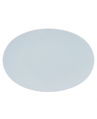 Simply smooth and modern in crisp white porcelain, the TAC 02 oval platter offers a timeless balance of form and function.