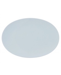 Simply smooth and modern in crisp white porcelain, the TAC 02 oval platter offers a timeless balance of form and function.