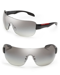 Shield-style Prada sunglasses are designed for urban warriors, with streamlined, gleaming lenses that have it all wrapped up. Shield-style Prada sunglasses are designed for urban warriors, with streamlined, gleaming lenses that have it all wrapped up.