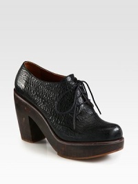 Refined lace-up silhouette of textured leather rests on a chunky wooden heel and platform. Wooden heel, 4 (100mm)Wooden platform, 1 (25mm)Compares to a 3 heel (75mm)Leather upperLeather liningRubber solePadded insoleImported Refined lace-up silhouette of textured leather rests on a chunky wooden heel and platform. Wooden heel, 4 (100mm)Wooden platform, 1 (25mm)Compares to a 3 heel (75mm)Leather upperLeather liningRubber solePadded insoleImported