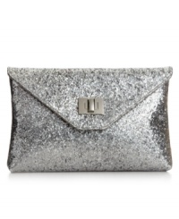 Every girl needs a little glitter on an evening out and this clutch from Style&co. is pretty perfect. Glam sequin adorns the design for instant eye-catching sparkle, while subtle silver-tone hardware offers extra dimension. Every girl needs a little glitter on an evening out and this clutch from Style&co. is pretty perfect. Glam sequin adorns the design for instant eye-catching sparkle, while subtle silver-tone hardware offers extra dimension.