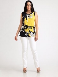 Let there be light. Slip into this vibrant, sleeveless top featuring a spectacular print and an impeccable silhouette, enhanced by a grosgrain belt.Round collarSleevelessSolid trimGrosgrain self beltAbout 29 from shoulder to hem95% polyester/5% elastaneMachine washImported Let there be light. Slip into this vibrant, sleeveless top featuring a spectacular print and an impeccable silhouette, enhanced by a grosgrain belt.Round collarSleevelessSolid trimGrosgrain self beltAbout 29 from shoulder to hem95% polyester/5% elastaneMachine washImported