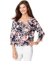 A graphic floral print adorns this bold peasant top from Jones New York Signature. Pair it with white trousers for a crisp ensemble. A graphic floral print adorns this bold peasant top from Jones New York Signature. Pair it with white trousers for a crisp ensemble.
