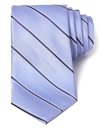 Knot this premium silk tie for a touch of luxury at the start of your day. Featuring an allover ribbon stripe design and a classic width for a traditional appeal. Knot this premium silk tie for a touch of luxury at the start of your day. Featuring an allover ribbon stripe design and a classic width for a traditional appeal.