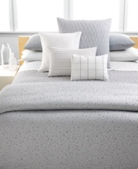 Inspired by the Greek island of Mykonos, Calvin Klein's Mykonos Pewter duvet cover features a textured circle pattern dispersed across a jacquard woven satin ground in muted tones of gray, white and blue. Hidden button closure. Inspired by the Greek island of Mykonos, Calvin Klein's Mykonos Pewter duvet cover features a textured circle pattern dispersed across a jacquard woven satin ground in muted tones of gray, white and blue. Hidden button closure.