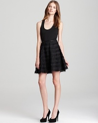 Say hello to the little black party dress. This Sachin + Babi dress merges edgy and elegant thanks to the leather trimmed waist that sits above a feminine, embroidered skirt. Say hello to the little black party dress. This Sachin + Babi dress merges edgy and elegant thanks to the leather trimmed waist that sits above a feminine, embroidered skirt.