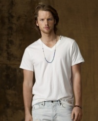 A tried-and-true classic for seasons to come, an essential cotton jersey V-neck tee is embellished with four antiqued metal studs for a vintage rock-and-roll feel. A tried-and-true classic for seasons to come, an essential cotton jersey V-neck tee is embellished with four antiqued metal studs for a vintage rock-and-roll feel.